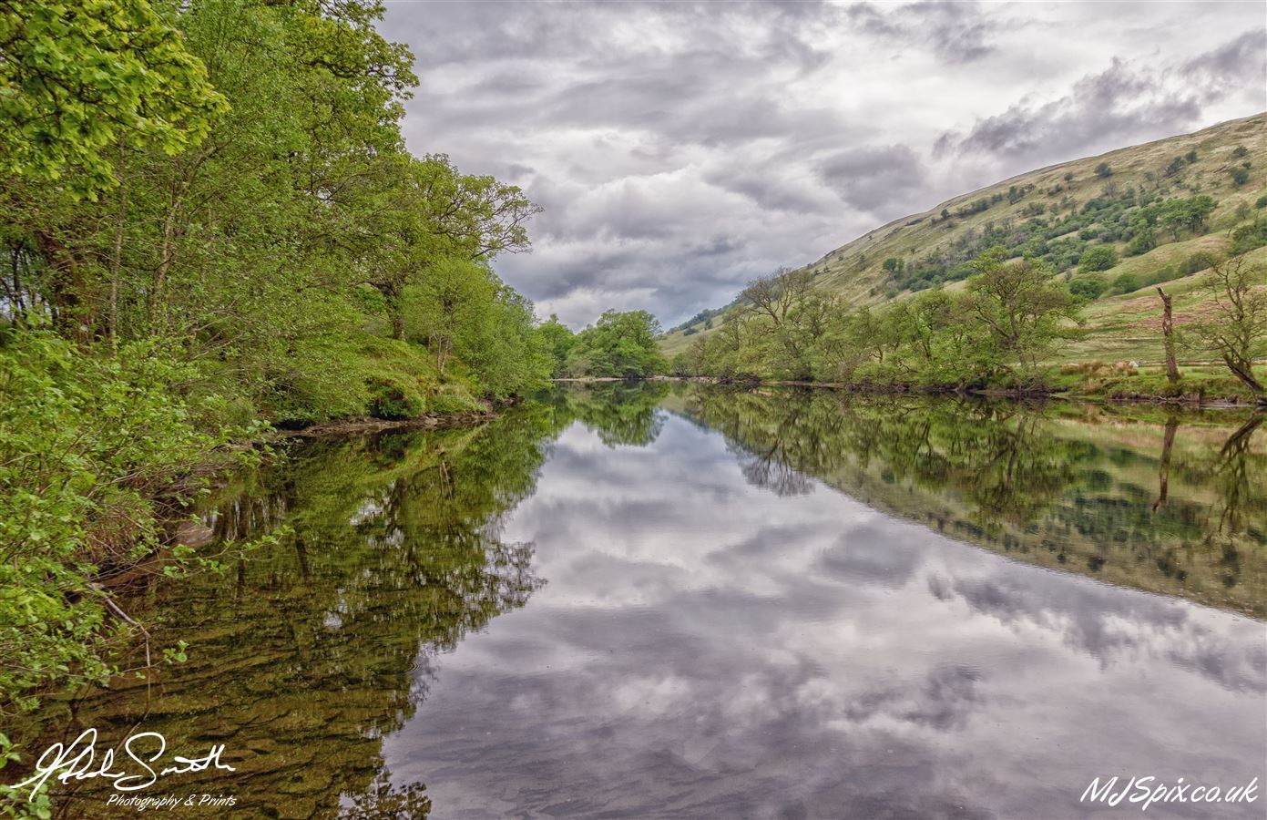 Beautiful still water reflecting the amazing landscape.

Photography by Malcolm J Smith