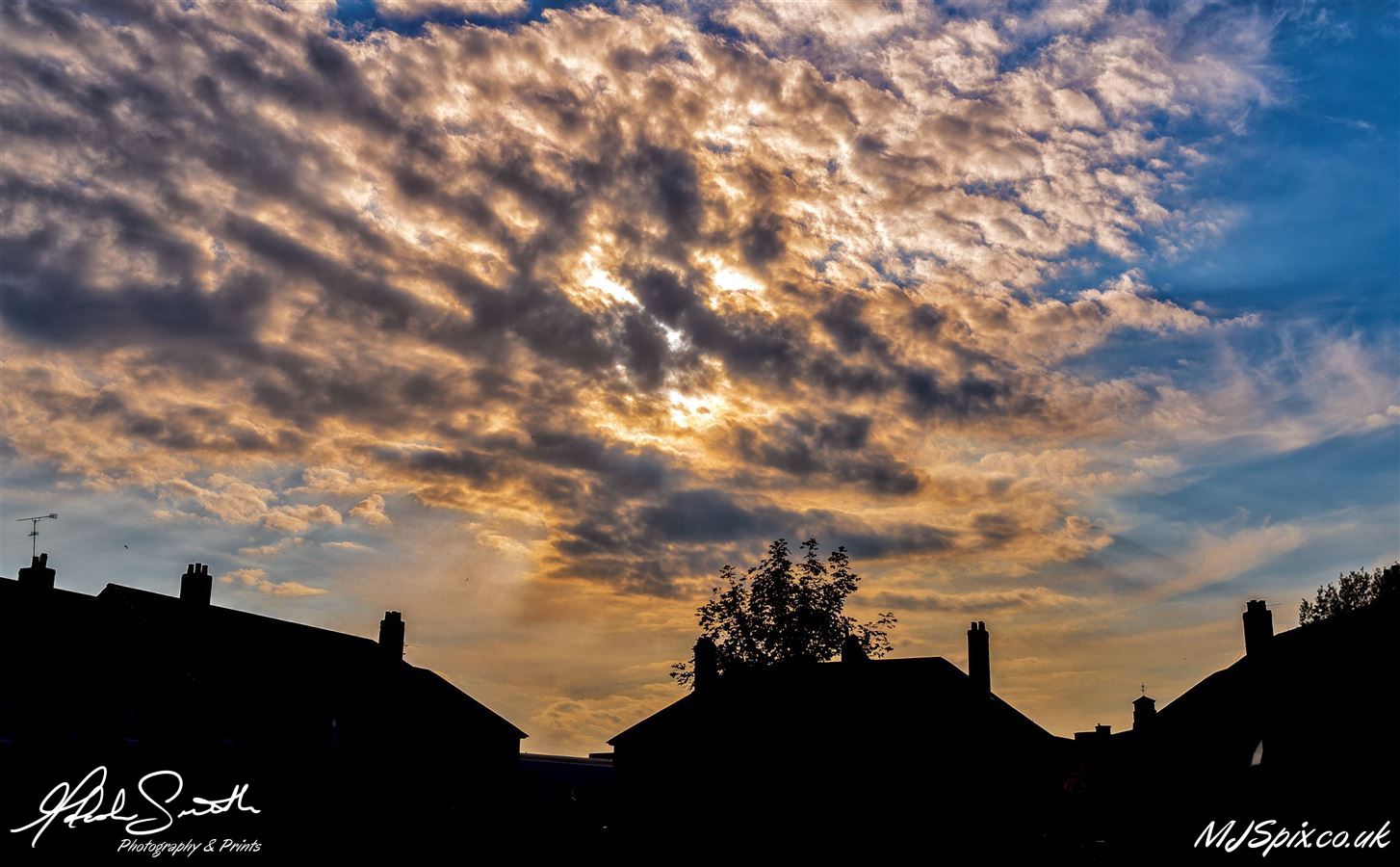 Sunset over the skyline from my garden.

Photography by Malcolm J Smith